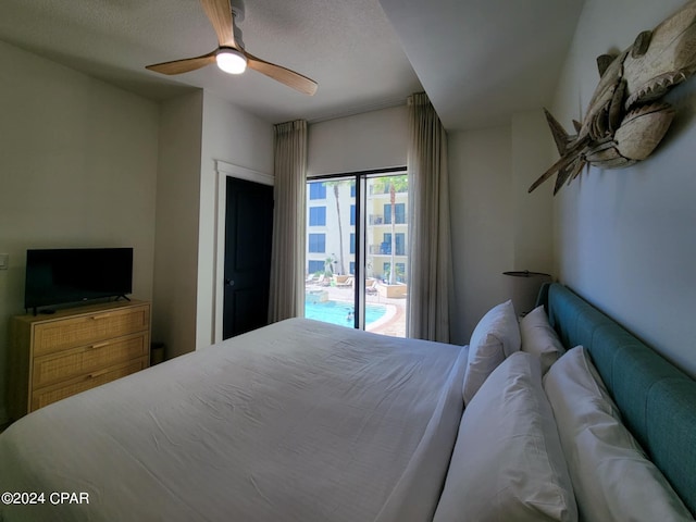 bedroom with ceiling fan and a textured ceiling