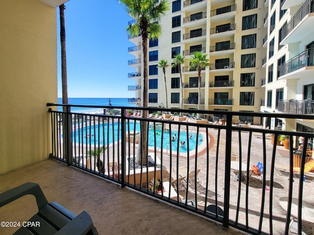 balcony featuring a water view