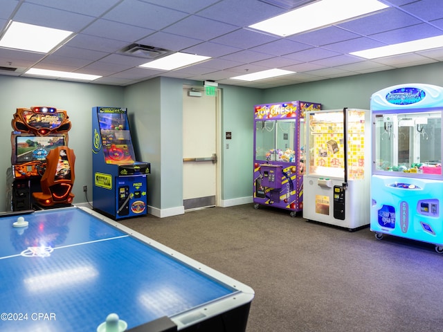 playroom featuring a paneled ceiling, baseboards, visible vents, and carpet