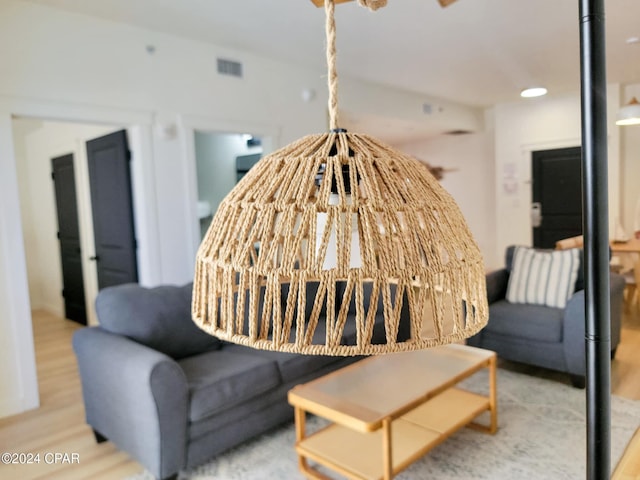 sitting room with wood finished floors and visible vents