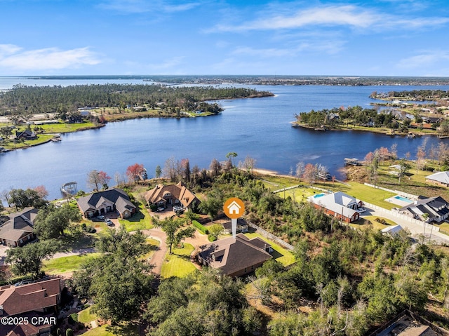 birds eye view of property with a water view