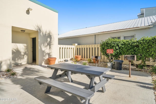 view of patio / terrace featuring outdoor dining space and fence