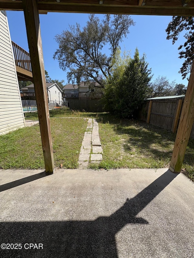 view of yard featuring a patio area and a fenced backyard