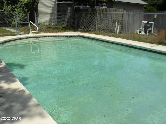 view of swimming pool featuring a fenced in pool and fence