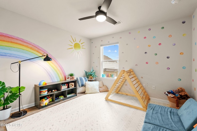 game room featuring a ceiling fan, wood finished floors, visible vents, and baseboards