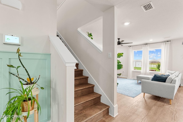 stairs with visible vents, recessed lighting, baseboards, and ceiling fan