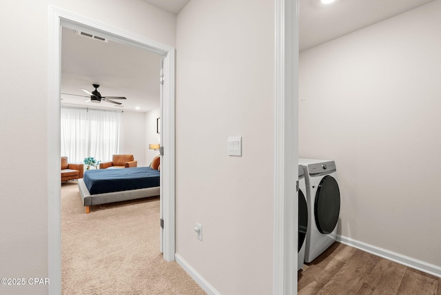 laundry room with a ceiling fan, baseboards, visible vents, laundry area, and separate washer and dryer