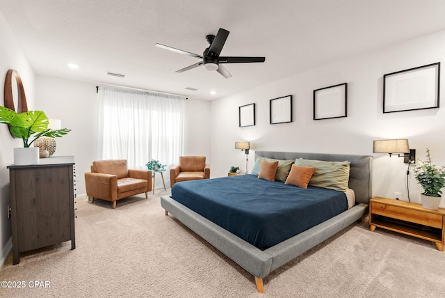 bedroom with recessed lighting, light colored carpet, and visible vents