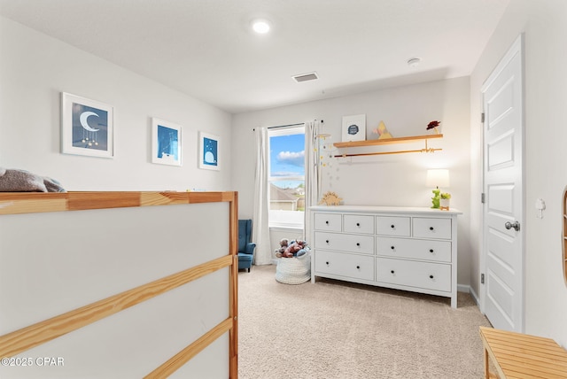 bedroom with light colored carpet and visible vents