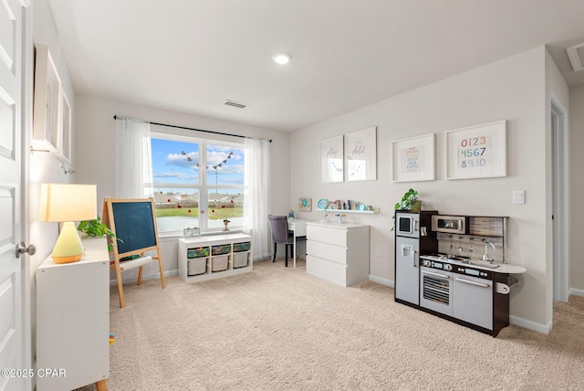 interior space with visible vents, baseboards, and carpet floors