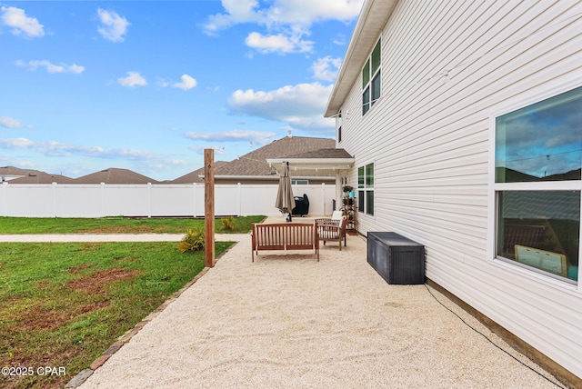 view of patio / terrace with an outdoor living space and fence