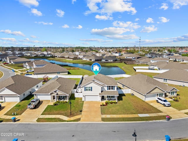 aerial view with a residential view and a water view