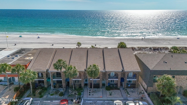 drone / aerial view featuring a view of the beach and a water view