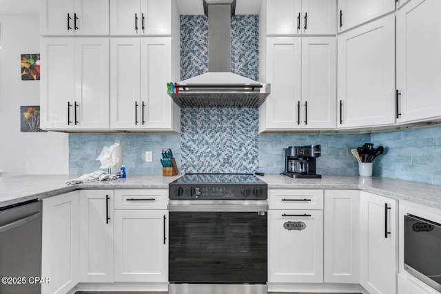 kitchen featuring backsplash, range with electric stovetop, white cabinets, wall chimney range hood, and dishwasher