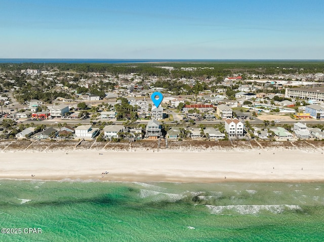 drone / aerial view with a residential view, a view of the beach, and a water view