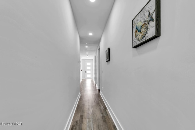 corridor with recessed lighting, baseboards, and wood finished floors