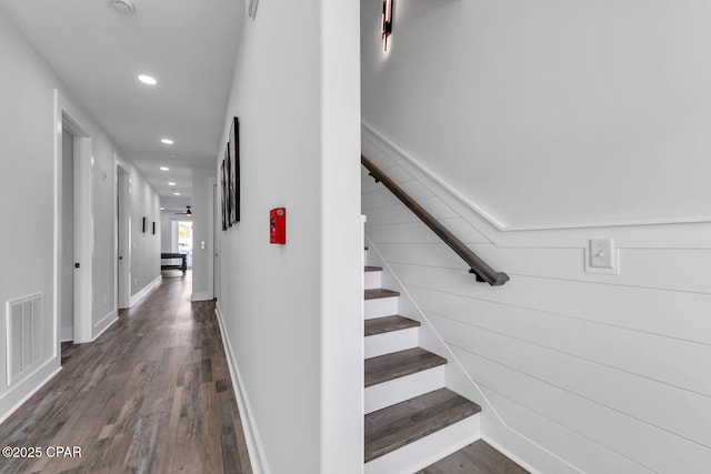 corridor with visible vents, recessed lighting, stairway, and wood finished floors