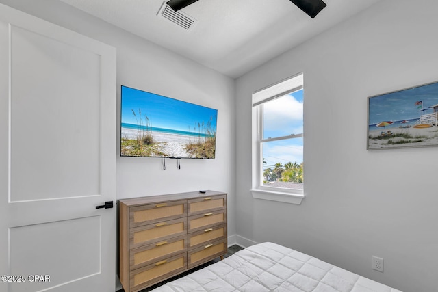 bedroom featuring visible vents and baseboards