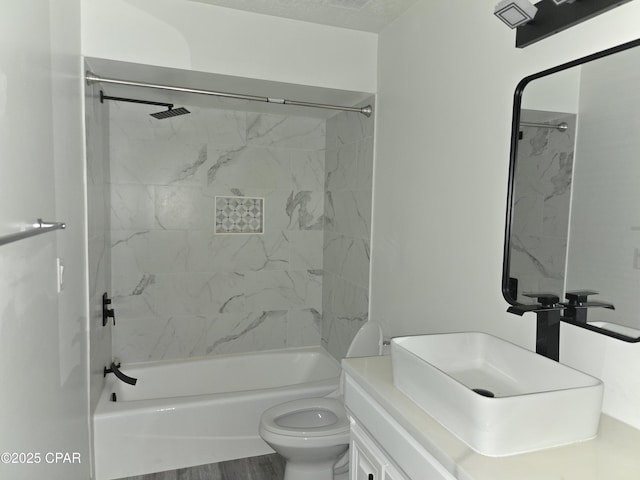 full bath featuring vanity,  shower combination, toilet, and wood finished floors