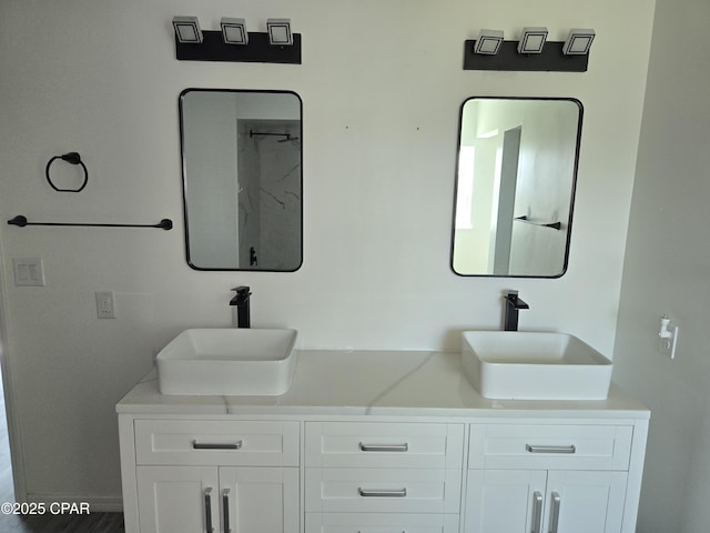 full bath with double vanity and a sink