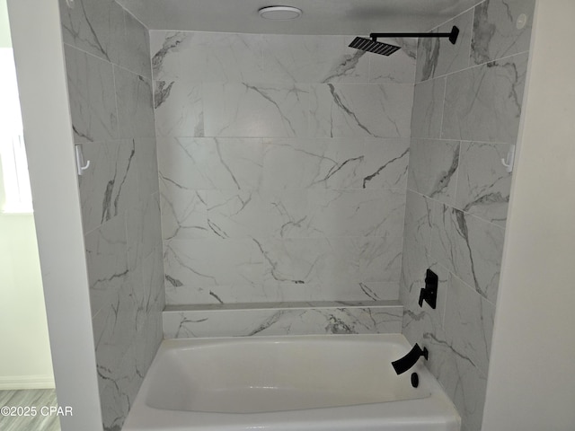 bathroom featuring washtub / shower combination