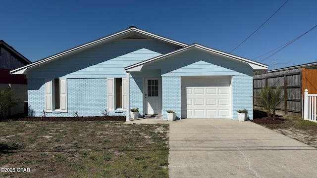 ranch-style house featuring driveway, brick siding, an attached garage, and fence