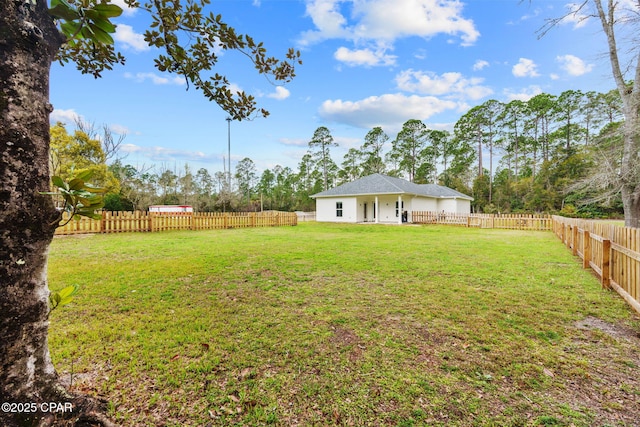 view of yard with a fenced backyard