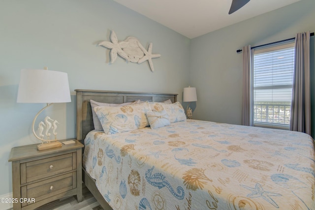 9860 S Thomas Dr Unit 1426, Panama City Beach, FL 32408 - bedroom with wood finished floors and a ceiling fan