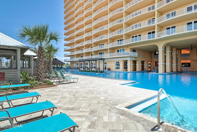 community pool featuring a patio area