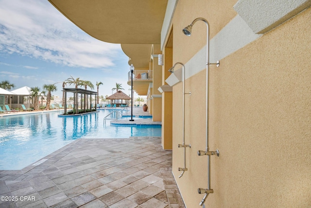 community pool with a patio area