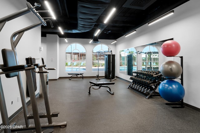 gym with visible vents and baseboards