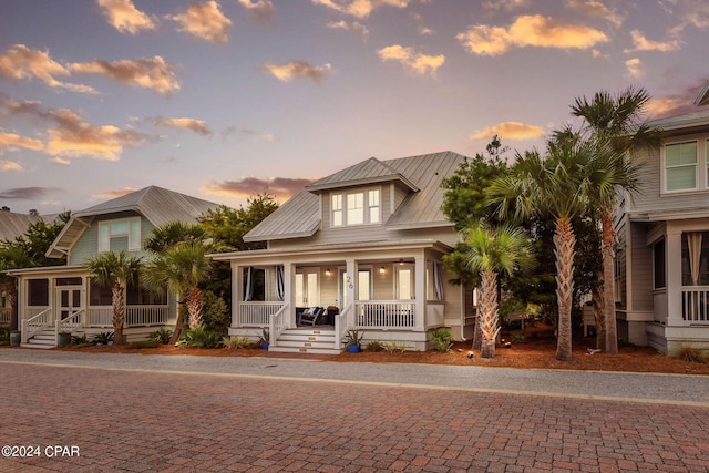 view of front of house featuring a porch and metal roof