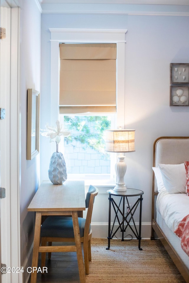 bedroom featuring baseboards and ornamental molding