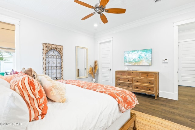 bedroom featuring recessed lighting, baseboards, wood finished floors, and ornamental molding