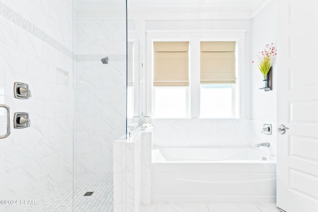 full bathroom with a garden tub, marble finish floor, and a tile shower