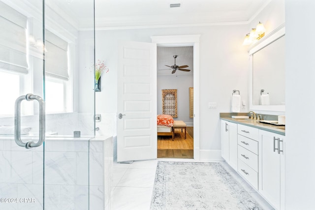 bathroom with vanity, a ceiling fan, a shower stall, ensuite bathroom, and crown molding