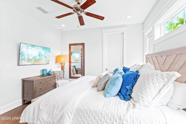 bedroom with visible vents, dark wood-type flooring, baseboards, recessed lighting, and a ceiling fan