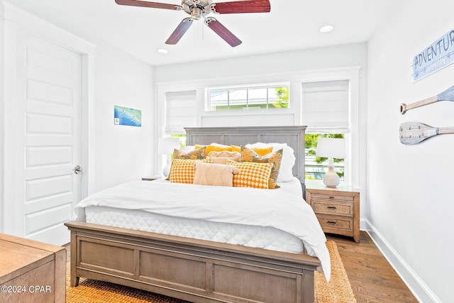 bedroom with recessed lighting, baseboards, light wood-style flooring, and a ceiling fan