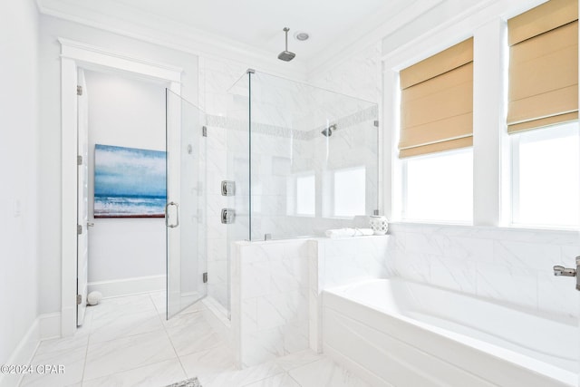 bathroom with baseboards, a shower stall, crown molding, a bath, and marble finish floor