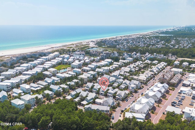 bird's eye view with a residential view, a view of the beach, and a water view