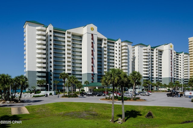 view of property with uncovered parking