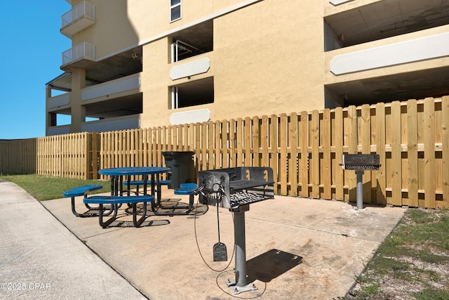 view of patio / terrace featuring fence