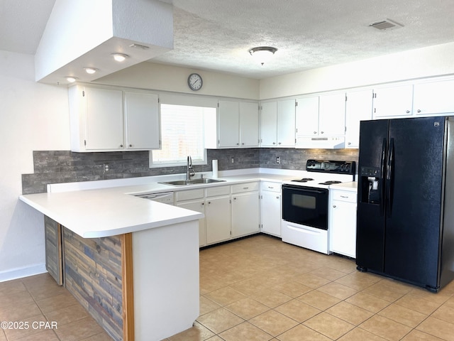 kitchen featuring electric stove, a sink, under cabinet range hood, a peninsula, and black refrigerator with ice dispenser