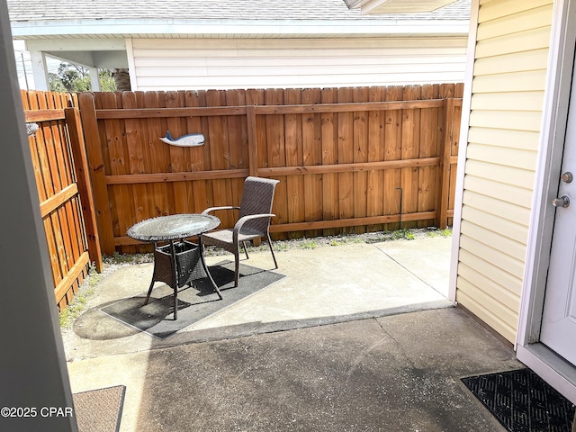 view of patio / terrace featuring fence