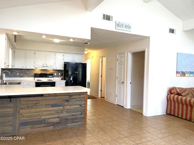 kitchen with electric range, visible vents, a sink, under cabinet range hood, and black fridge with ice dispenser