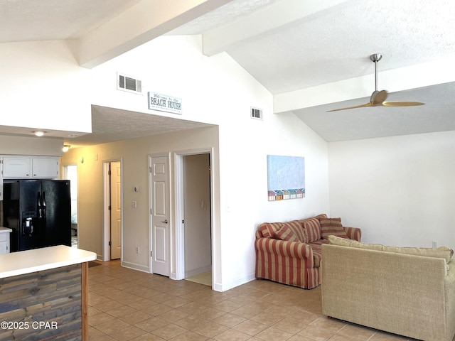 living room with visible vents, beam ceiling, baseboards, and ceiling fan