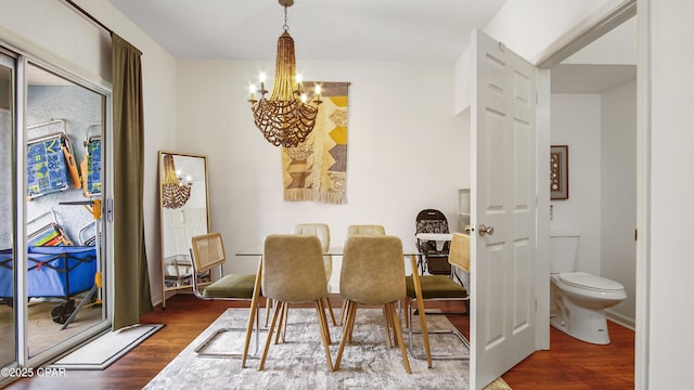 dining room with an inviting chandelier and wood finished floors