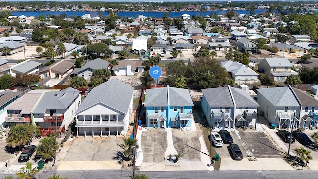 aerial view with a residential view and a water view