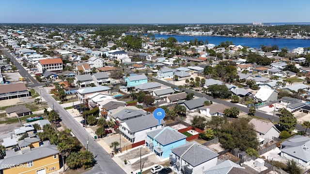 birds eye view of property with a water view and a residential view