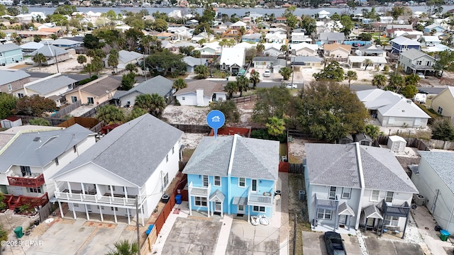 birds eye view of property with a residential view and a water view